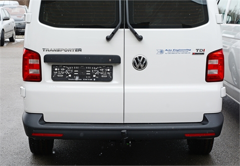 Vehicle, trailer and a cage for transportation of service dogs