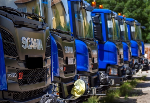 Truck with winch, on-board superstructure and hydraulic crane