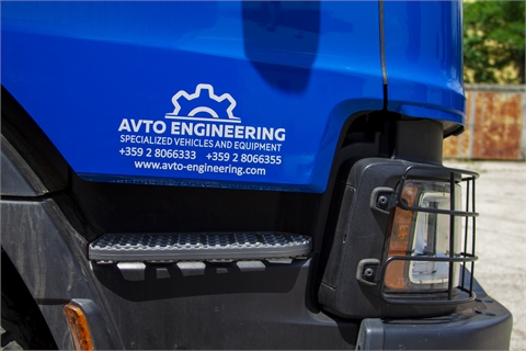 Truck with winch, on-board superstructure and hydraulic crane