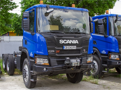Truck with winch, on-board superstructure and hydraulic crane