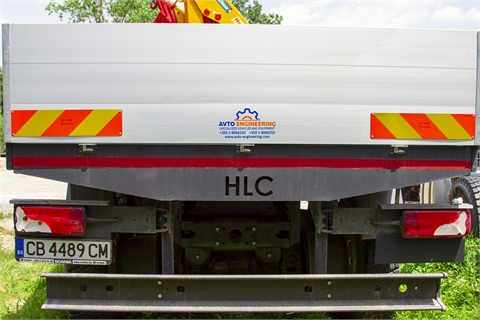 Truck with winch, on-board superstructure and hydraulic crane